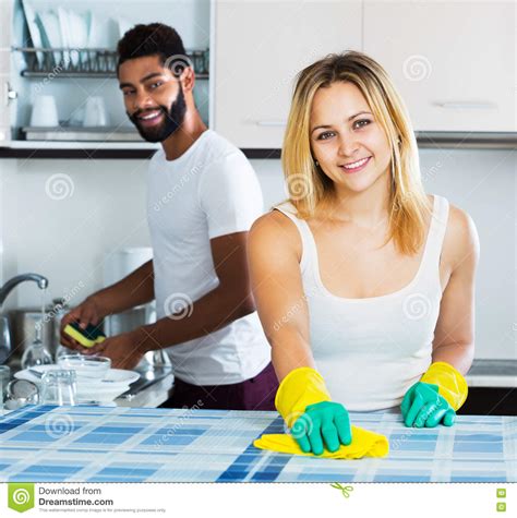Interracial Couple Cleaning In The Kitchen Stock Image Image Of Caucasian Liquid