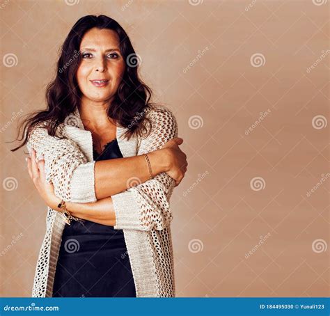 Pretty Brunette Confident Mature Woman Posing Cheerful On Warm Brown Background Lifestyle
