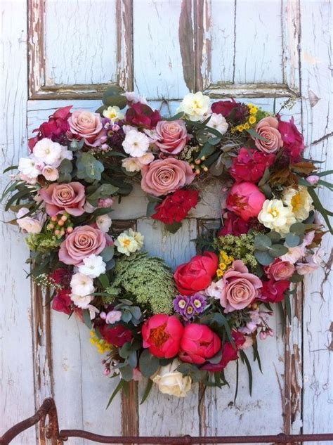 A Faux Floral And Greenery Wreath Shaped As A Heart Floral Wreath