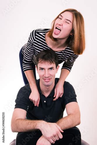 Best Friends Having Fun Young Girl Grimacing And Pulls Her Tongue