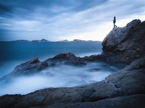 Rock Cliff Man Sea Loneliness Water Hd Wallpaper Peakpx