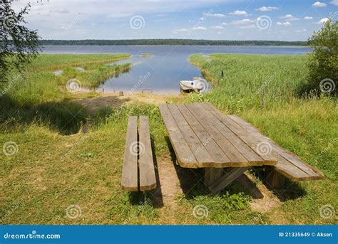Wooden Table With Benches On The Shore Of Lake Stock Image Image Of