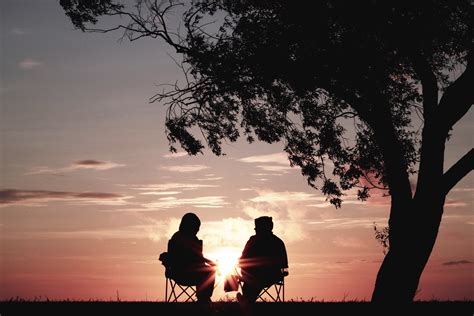 Silhouette Of Man And Woman Sitting Near Tree Free Image Peakpx