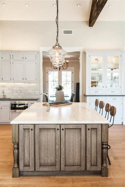 White interior of kitchen room with large kitchen island, modern pendant lights and storage combination. Brown Kitchen Island and Clear Glass Schoolhouse Pendants ...