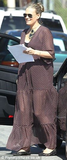 Molly Sims Smuggles Her Growing Bump In Floaty See Through Dress