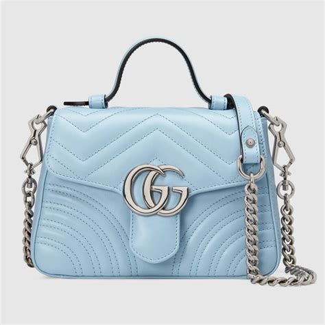 I am a huge fan of shoulder bags, specifically this one. Gucci GG Women GG Marmont Mini Top Handle Bag-Blue - LULUX