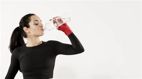 Premium Photo Front View Of Sporty Woman Drinking Water