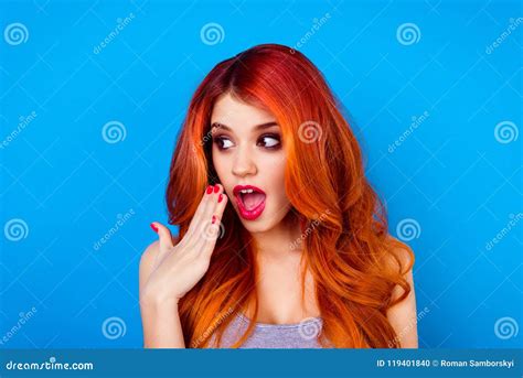 close up portrait of attractive cute girl with long ginger ombre fair hair with surprised face