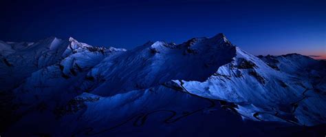2560x1080 Dark Blue Sky Above Snow Covered Mountain 2560x1080