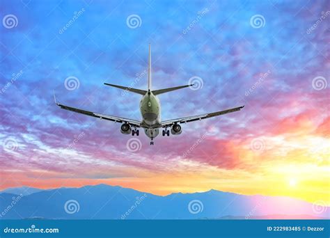 Flying Plane Over The Mountains During A Beautiful Sunset Stock Image