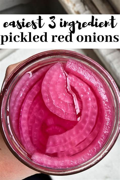 A Hand Holding A Jar Filled With Pickled Onions And Text Overlay