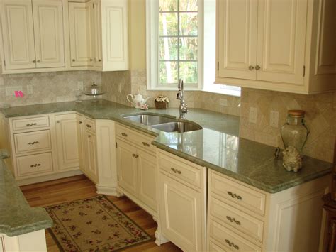 Dark wood floors and a white kitchen island with marble countertops create a rich and relaxing experience. 5 Favorite Types of Granite Countertops for Stunning ...