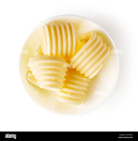 Bowl Of Butter Curls Isolated On White Background Top View Stock Photo