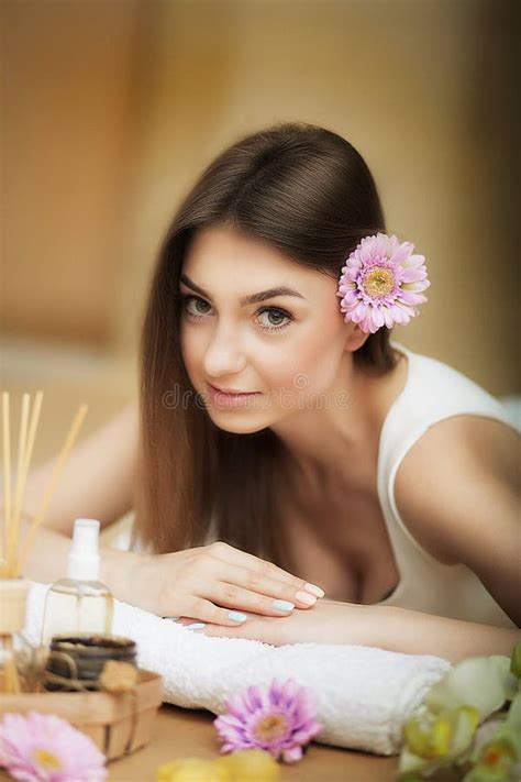 Portrait Of A Beautiful Woman Skin Care Spa Treatments Flower In Hair The Concept Of Beauty