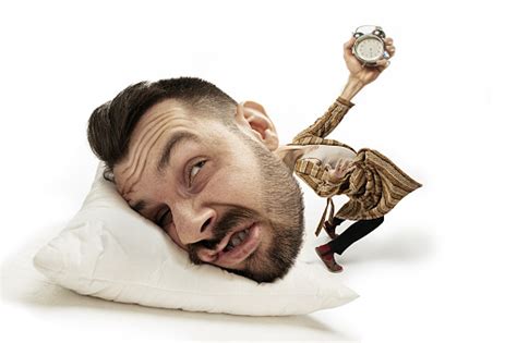 Big Head On Small Body Lying On The Pillow Stock Photo