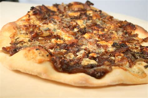 Caramelized Onion Pizza With Roquefort And Roasted Garlic And Pesto