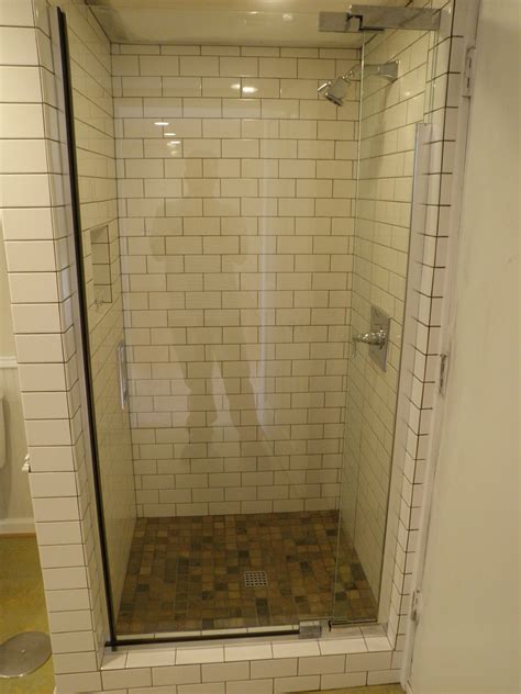 Do you suppose shower tile ideas for small bathrooms seems to be nice? Subway tile and glass door for small shower stall. | Small ...