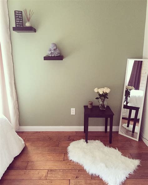 I have that age green bedroom walls, and i have a navy blue spread with bright colors. Zen Style Bedroom. Sage green wall paint, Buddha accessory, white roses. | Sage green bedroom ...