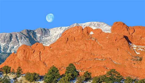 The Argent Moon Adorns The Cobalt Blue Sky That Colorado Is Famous For
