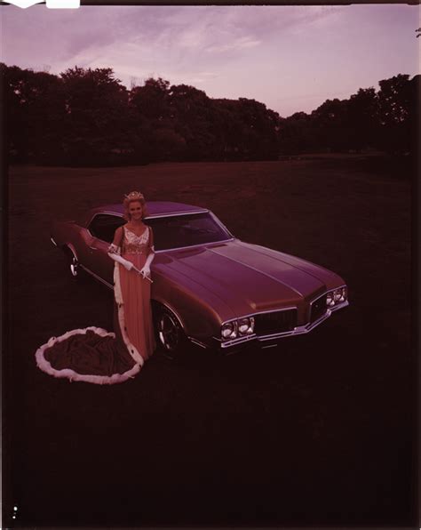 Pam Eldred Posing With A 1970 Oldsmobile Cutlass Supreme Automobile