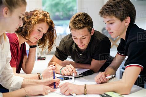 Young Students Studying Together At Table Stock Photo Dissolve