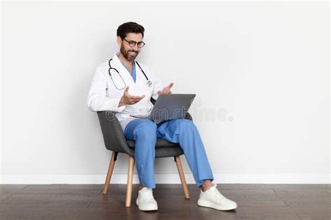 Telemedicine Concept Smiling Male Doctor Using Laptop For
