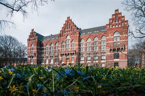 The Historic Red Brick Lund University Library In Front Of Spring