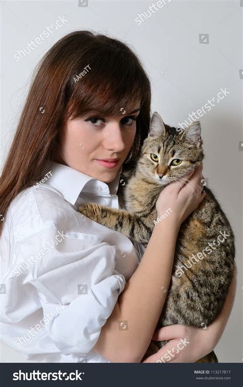 A Girl Holding A Cat In Her Arms Stock Photo 113217817 Shutterstock