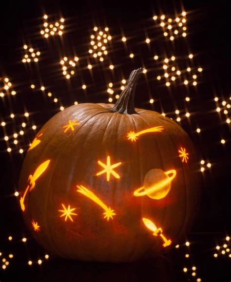 A Carved Pumpkin With Stars And Planets On It