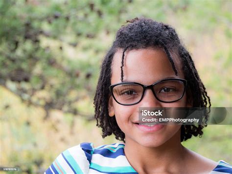 Portrait Of A Smiling African American Girl Stock Photo Download