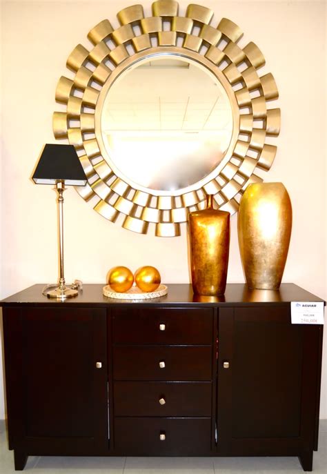 El aparador de salón es un mueble multifuncional que te sirve para decorar y al mismo tiempo resguardar algunos elementos del hogar. Aparador wengué: 250 euros Espejo redondo: 285 euros www.aguiar.es | Home decor, Decor, Furniture