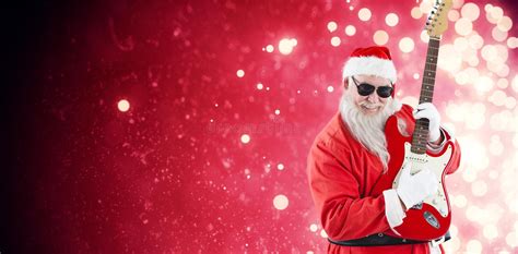Composite Image Of Cheerful Santa Claus Playing Guitar Stock Photo