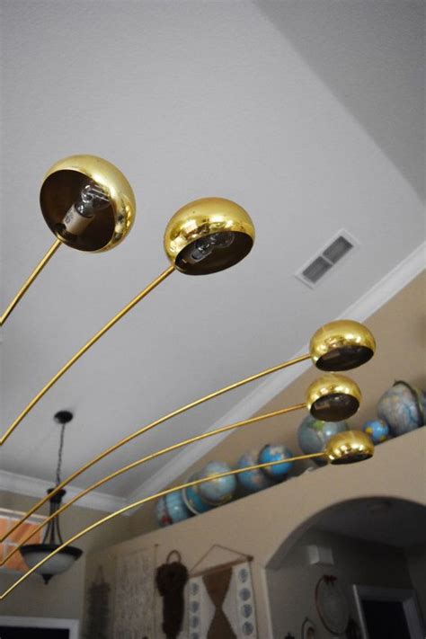Located in los angeles, ca. Vintage mid century modern brass arc orb floor lamp ...