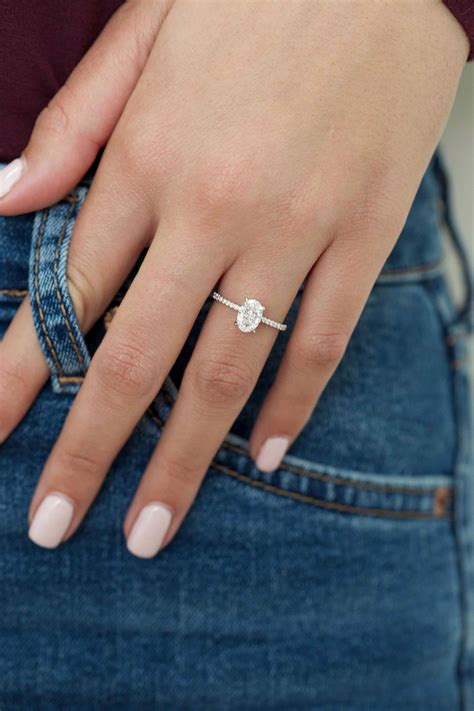 Love this Oval engagement ring in white gold surrounded by gorgeous