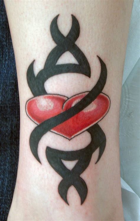 Armband tattoos are designs that usually wrap around the wrist or biceps. Cool Tribal Love Heart Tattoos Pictures - | TattooMagz ...