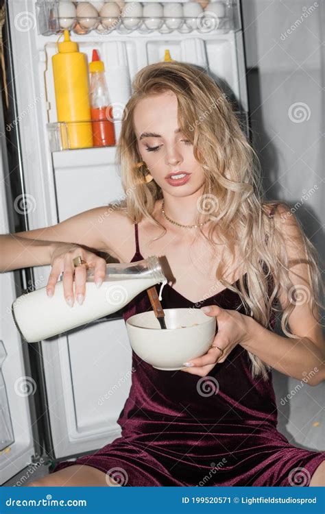 Blonde Woman Pouring Milk Into Bowl Stock Image Image Of Sensual