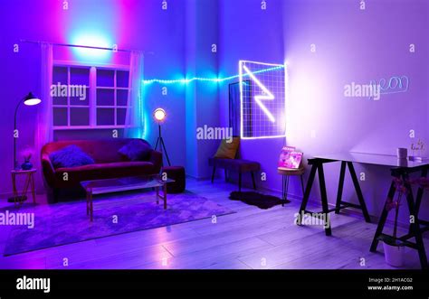 Interior Of Stylish Living Room With Neon Lighting Stock Photo Alamy