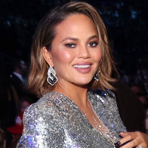 Chrissy Teigen Flaunts Baby Bump In Red Hot Ensemble See The Look