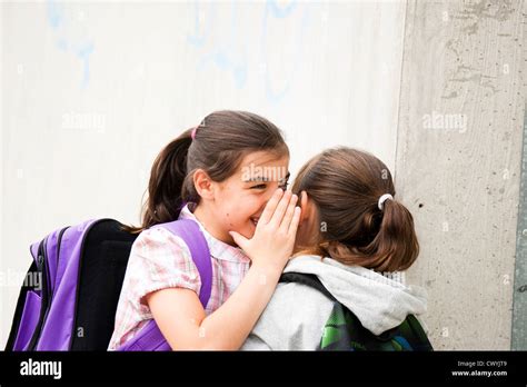 Two Happy Girls Whispering Stock Photo Alamy