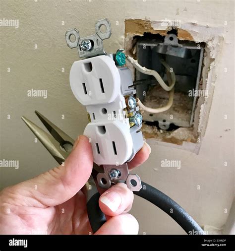 Diy Electrical Outlet Repair In An Old House Stock Photo Alamy