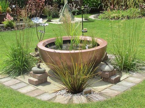 This deep, flat stone hides it nicely. 71 best images about Container ponds for water gardening in small spaces on Pinterest | The pond ...