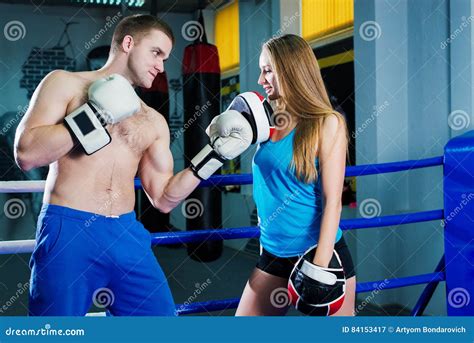Male And Female Sporty Couple Practicing Boxing At The Gym At Boxing