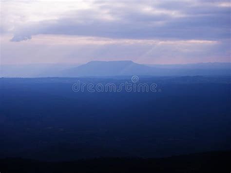 Cold Tone Sunset Sky Wide Mountain Landscape At Pha Yieb Mek In Phu