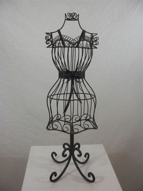 It's a lightweight type that will see you enjoy moving it around effortlessly. BROWN Wrought Iron Dress Form Metal Home Decor 22" high ...