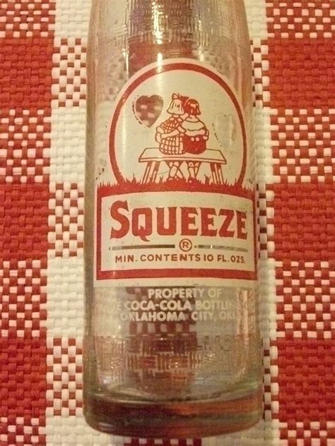 Squeeze Soda Collectible Bottle Red And White And Bottled In