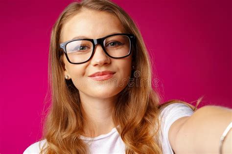 Portrait Of A Young Attractive Caucasian Woman In Glasses Stock Photo