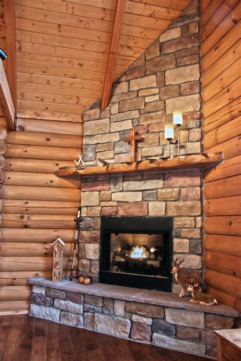 Most log cabin fireplaces are made using stone which is one of the most complimentary materials available to wood. Photos of this log home nestled in the countryside of Kentucky