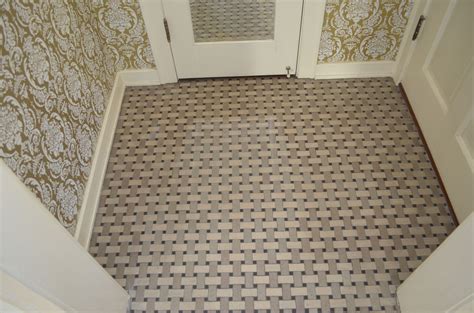 Spa like bathroom features upper walls painted a soothing green and lower walls clad in subway tiles lined with a claw foot tub fitted with a ceiling mounted shower rail and a gray trellis shower curtain next to a restoration hardware. Original 1920s Basket-Weave Tile | Basket weave tile, Tiles, Flooring