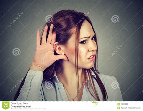 Woman With Hand To Ear Gesture Listening Carefully Stock Photo Image