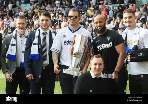 Leeds Rhinos Players With The Super League Trophy At Half Time During